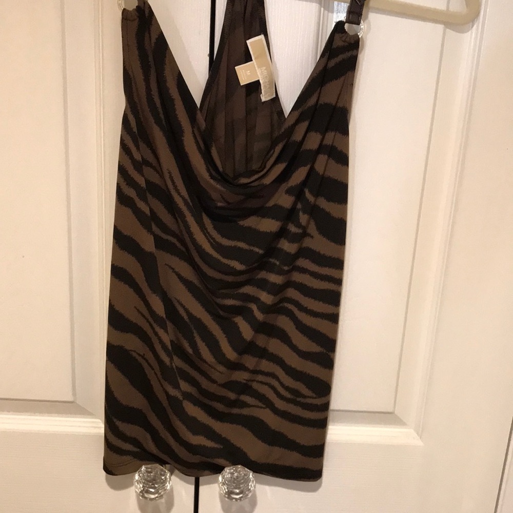 Sexy halter drapes easily for elegant dressing.